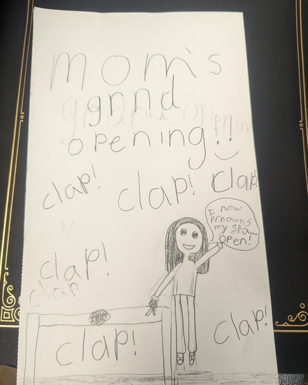 A child's drawing celebrating Mom's grand opening of the spa